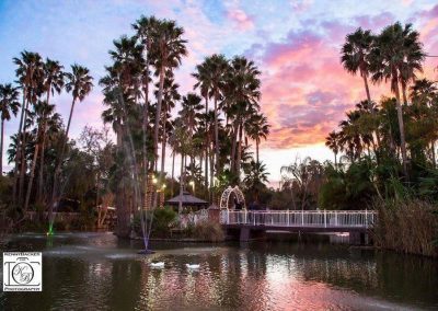 the sun sets over the lagoon at Rancho de las Palmas, a wedding and event venue in Moorpark, CA